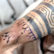 "iInuit sewing tattoo"